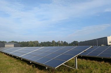 pexels-photo-28321970-28321970 Solar panels in a Ratzeburg field, capturing renewable energy on a clear day.