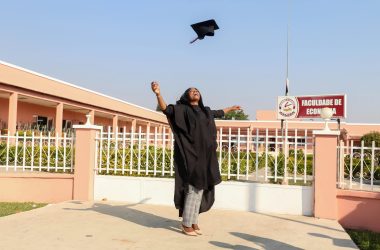 pexels-photo-3028514-3028514 A jubilant graduate celebrating outside Huambo's university with a gown and mortarboard tossed in the air.